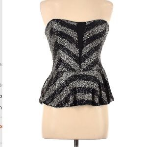 Black and silver rhinestone peplum top. Sleeveless sweetheart neckline